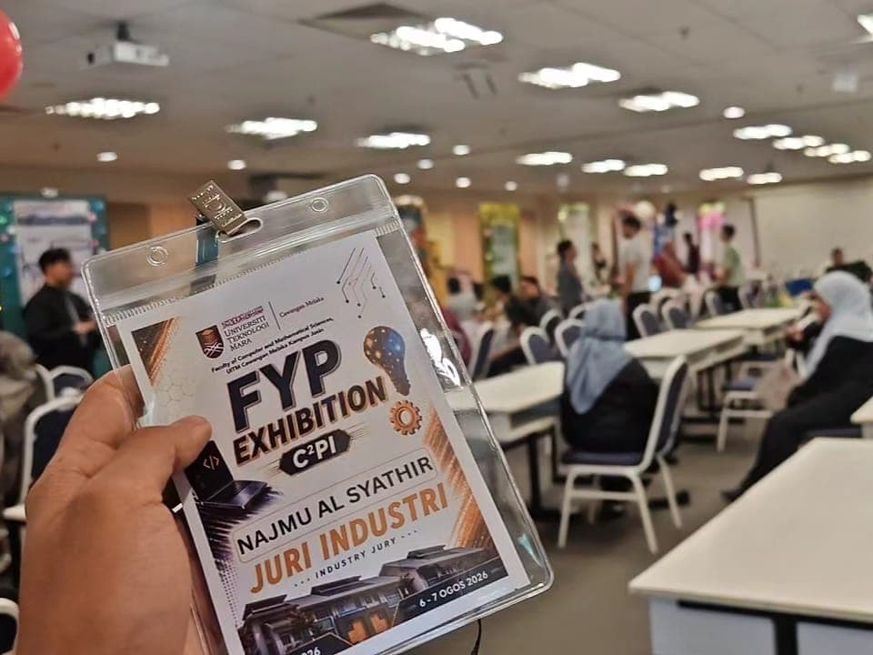 Holding the jury badge inside the FYP exhibition hall